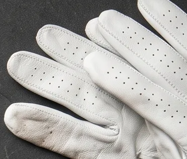 White cabretta golf gloves with perforated fingers
