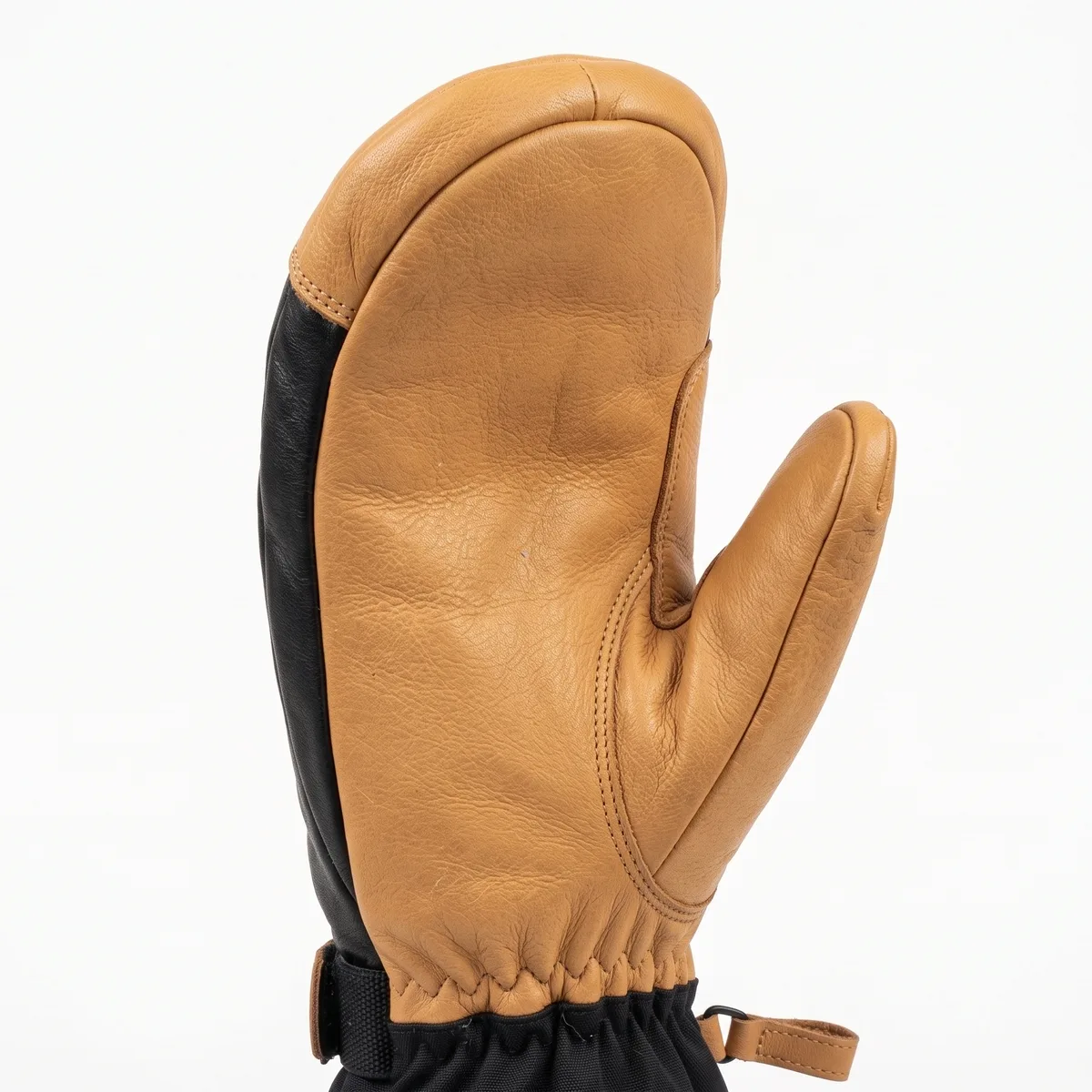 Close-up of the tan leather palm on a ski mitten